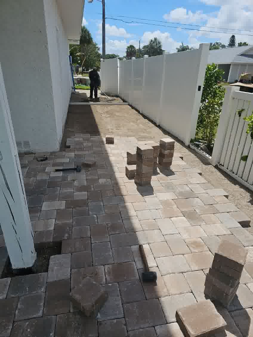 insignia landscape pinellas park pavers landscape lighting - Insignia Landscape A paver patio being installed for a happy client.